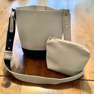 Madison West Crossbody Bag Cream  Black w/ separate small bag. Trendy Minimalist